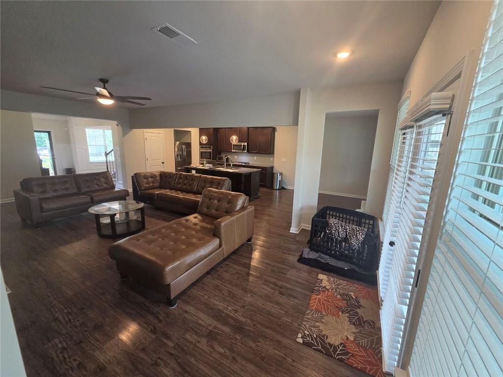801 Relic Ridge Hampton, GA 30228 - Photo 31 of 44 a living room with furniture and a flat screen tv