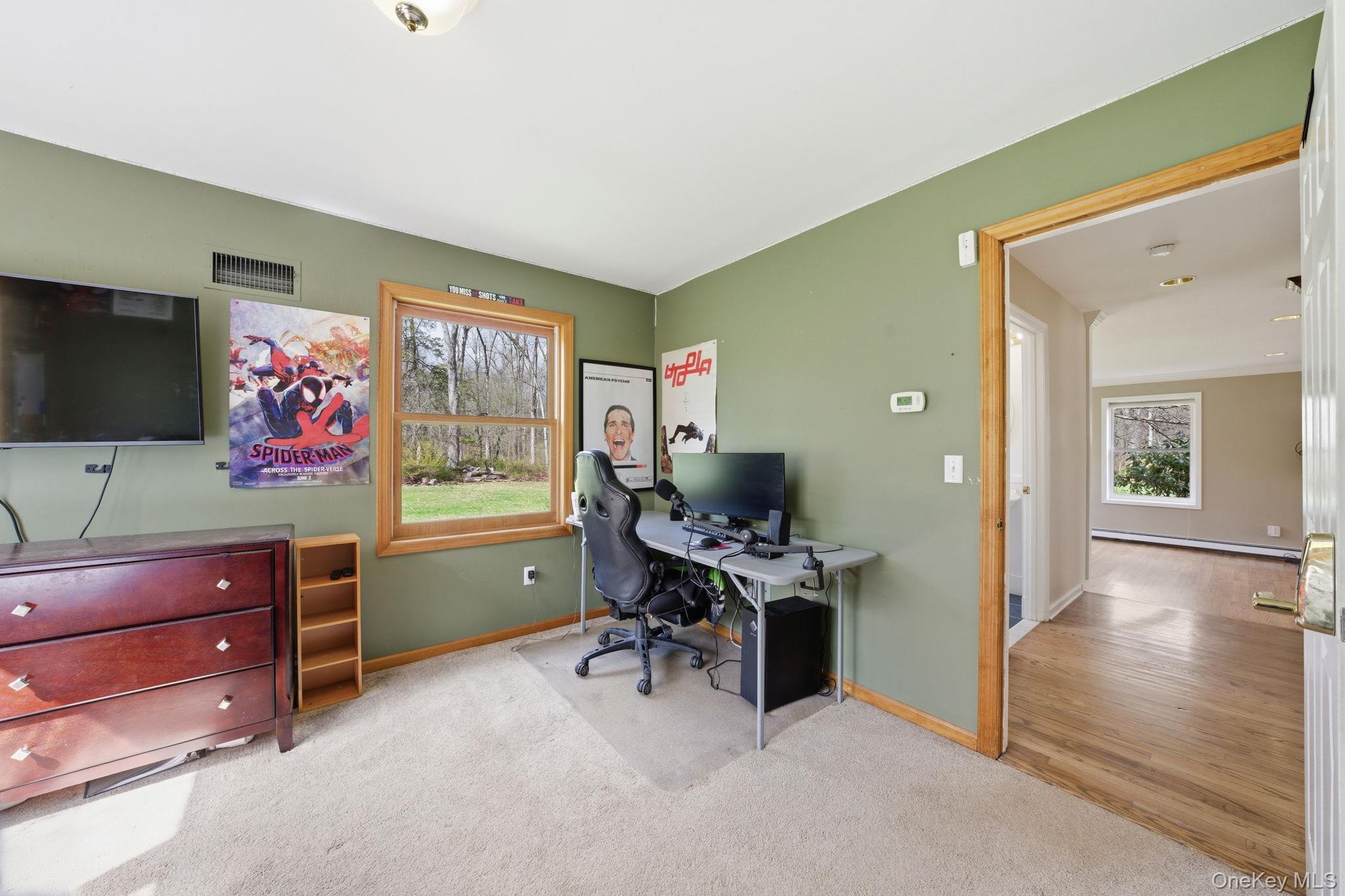 83 Onderdonk Road Warwick, NY 10990 - Photo 16 of 40 a view of a livingroom with furniture and a flat screen tv