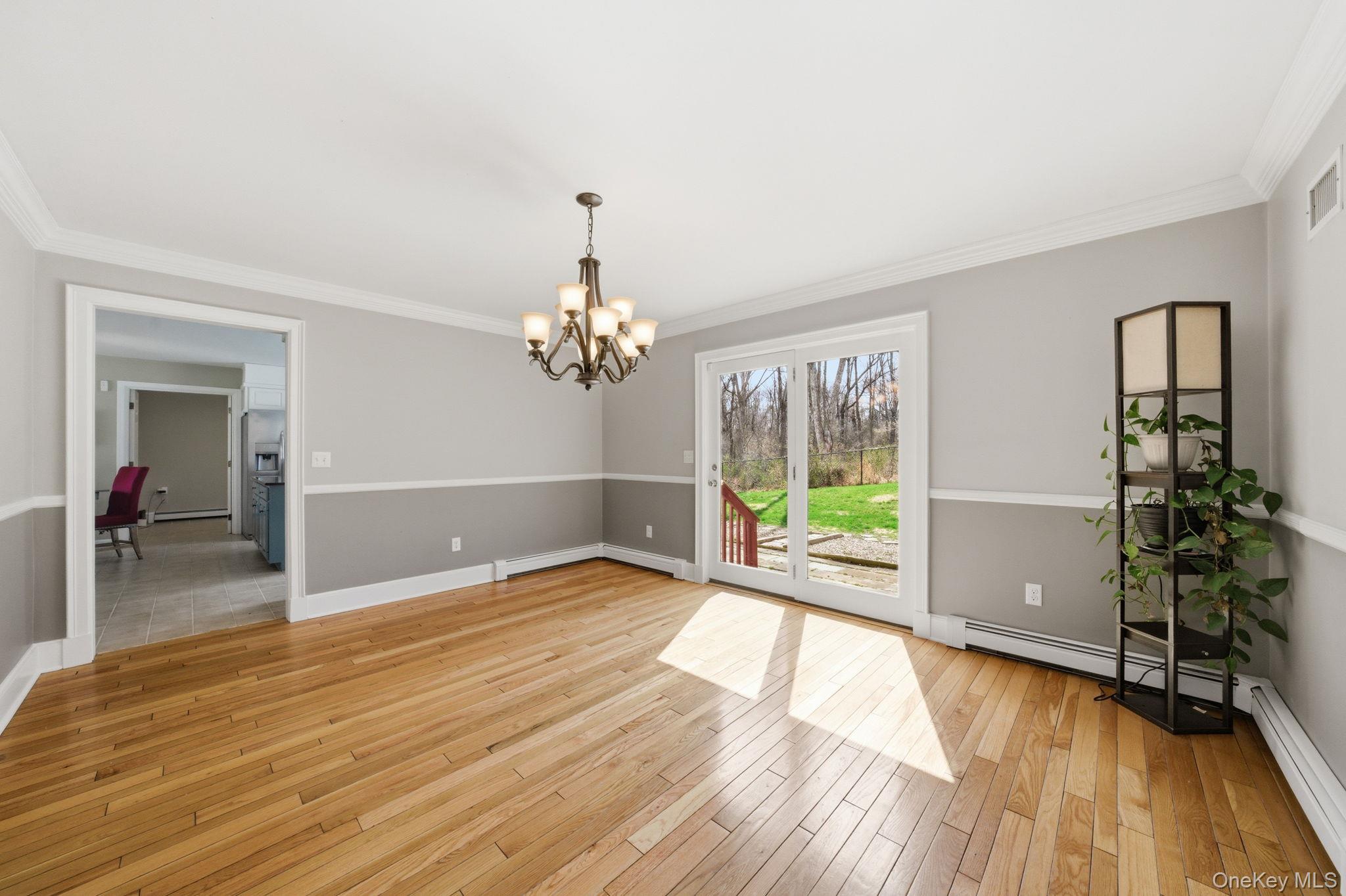 83 Onderdonk Road Warwick, NY 10990 - Photo 17 of 40 a view of a room with wooden floor staircase and a kitchen
