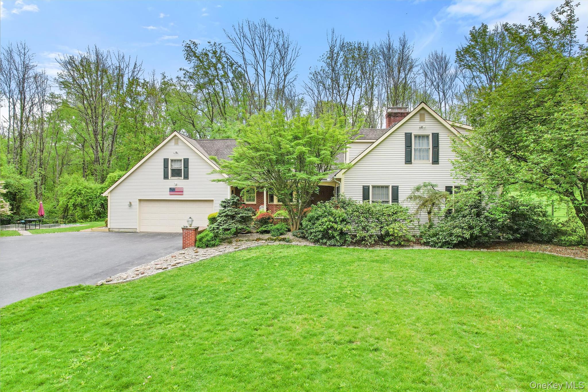 83 Onderdonk Road Warwick, NY 10990 - Photo 2 of 40 a front view of a house with a yard and trees