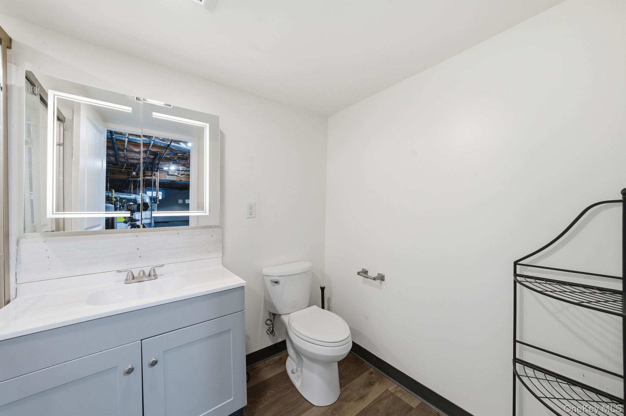 83 Onderdonk Road Warwick, NY 10990 - Photo 34 of 40 a bathroom with a toilet a sink and mirror
