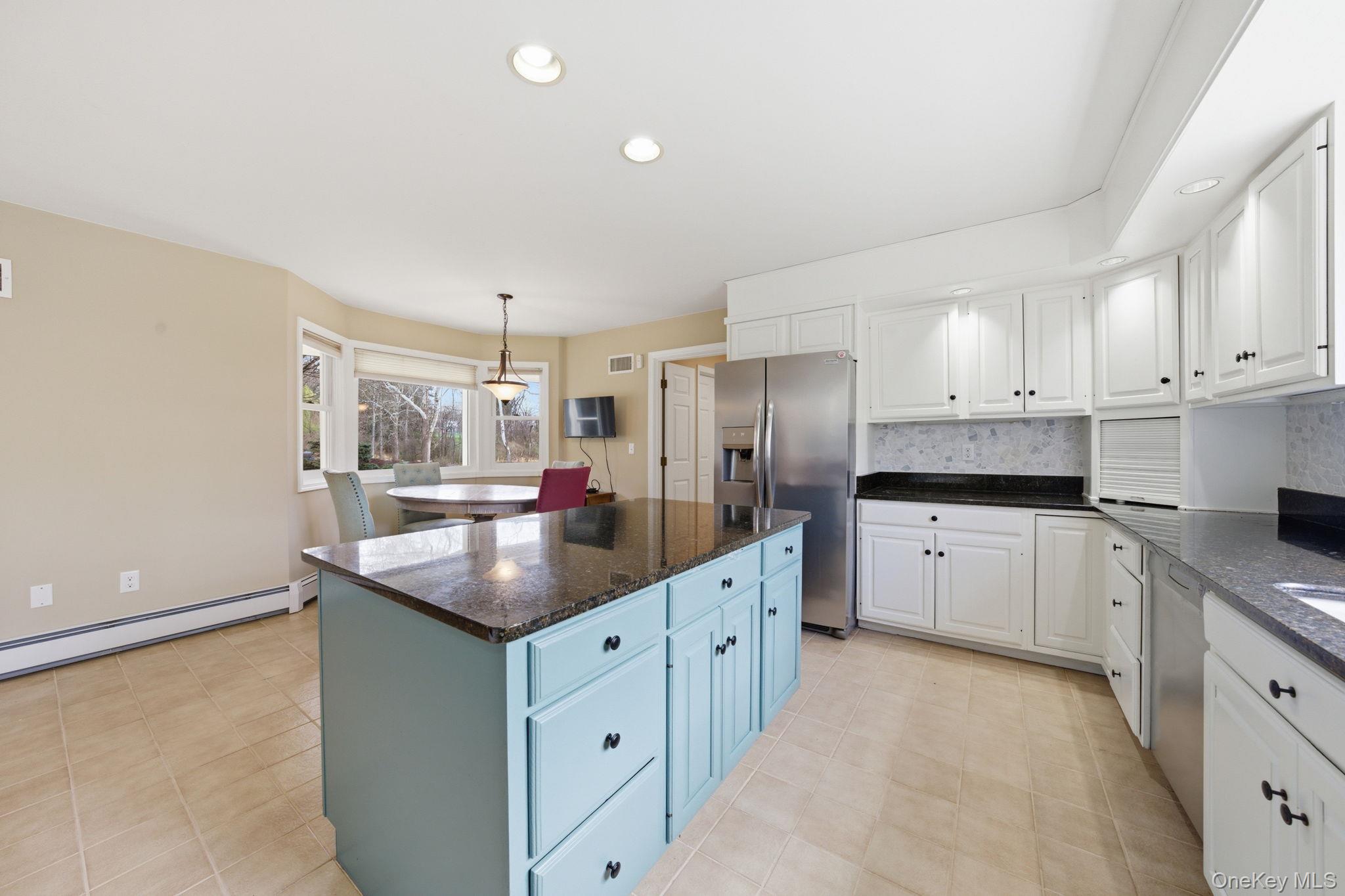 83 Onderdonk Road Warwick, NY 10990 - Photo 5 of 40 a kitchen with granite countertop a sink and cabinets