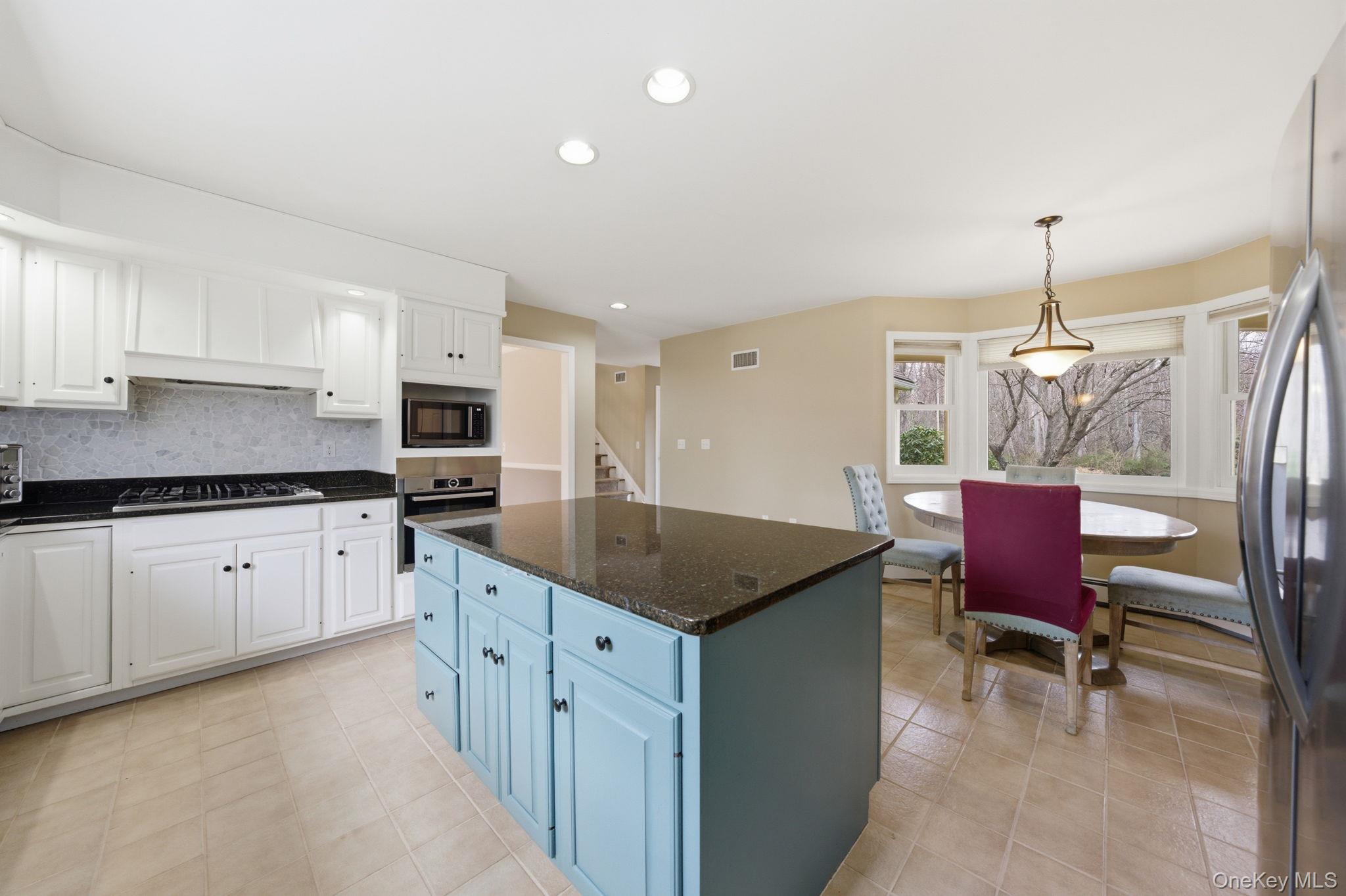 83 Onderdonk Road Warwick, NY 10990 - Photo 6 of 40 a kitchen that has a lot of cabinets in it and appliances