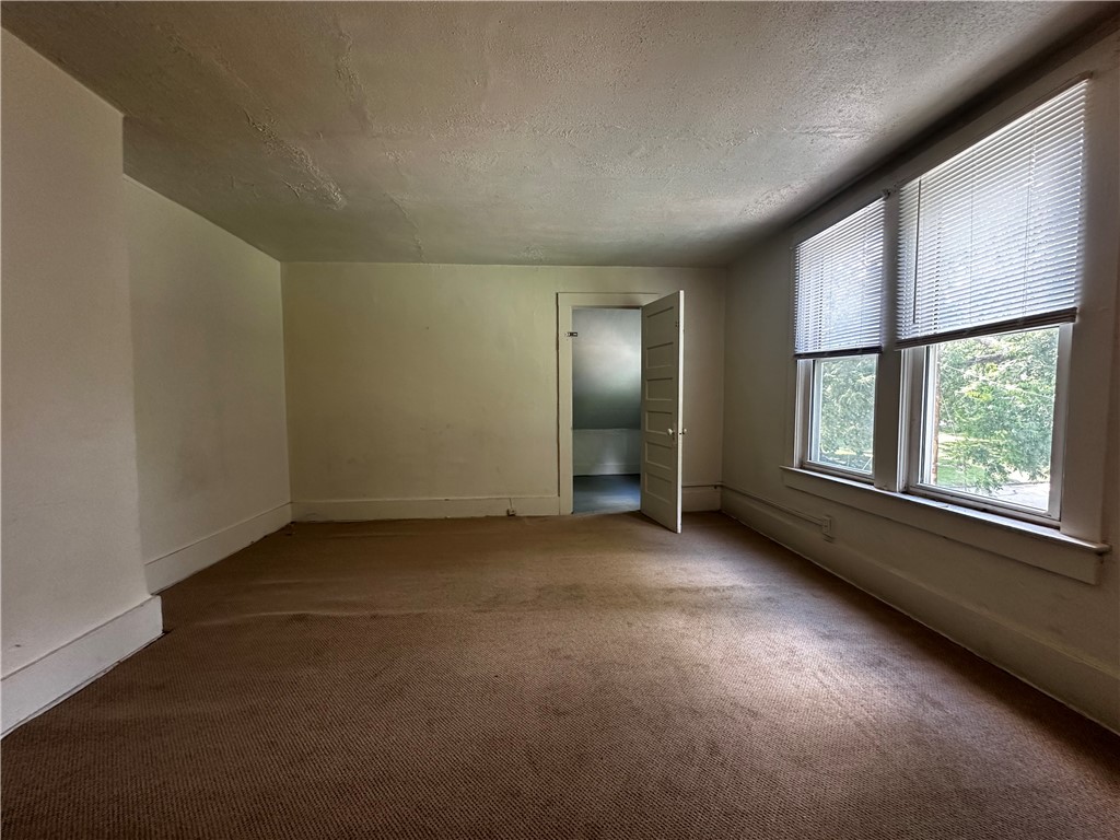 996 West Packard Street Decatur, IL 62522 - Photo 6 of 14 an empty room with windows