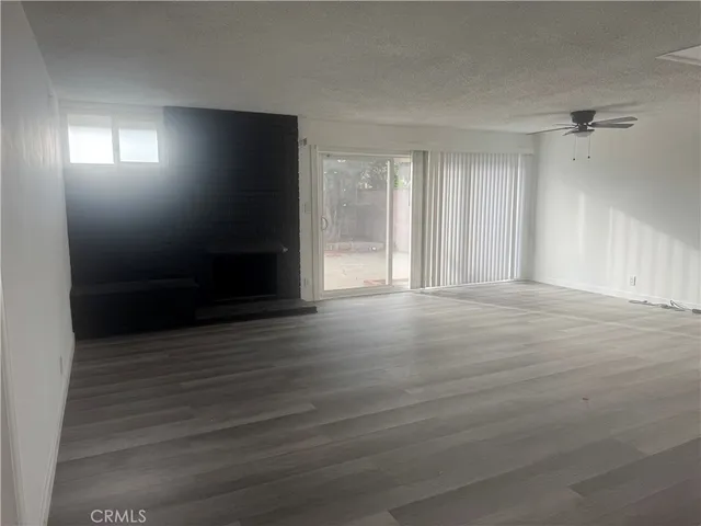 a kitchen with kitchen island a sink a stove and refrigerator