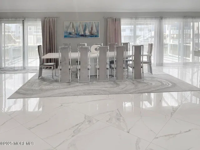 a view of a livingroom with furniture and windows