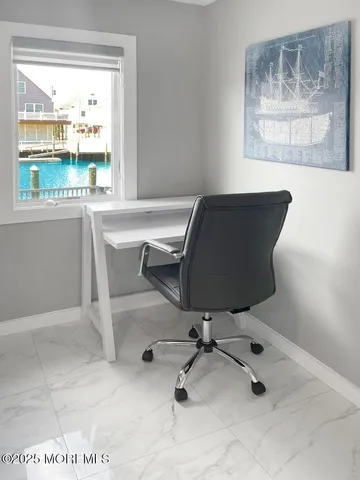 a view of a hallway with windows