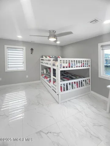 a bedroom with furniture and a window