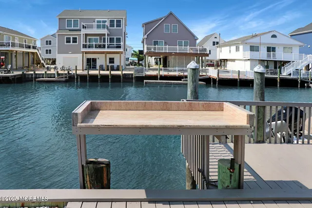 a lobby with a couch and wooden floor