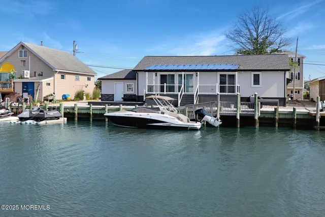 a view of a swimming pool with outdoor seating