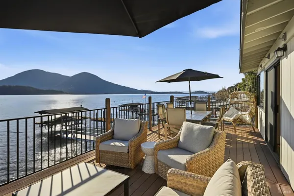 a balcony with furniture and a potted plant