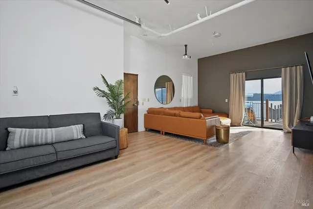 a terrace with outdoor seating and city view