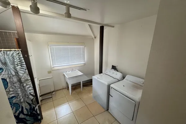 a bathroom with a toilet sink and tub