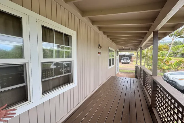 a view of a house with wooden floor and windows