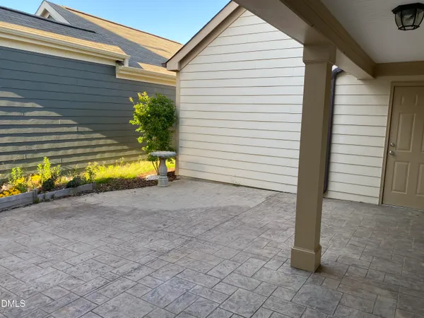 a view of a house with a yard and a garage