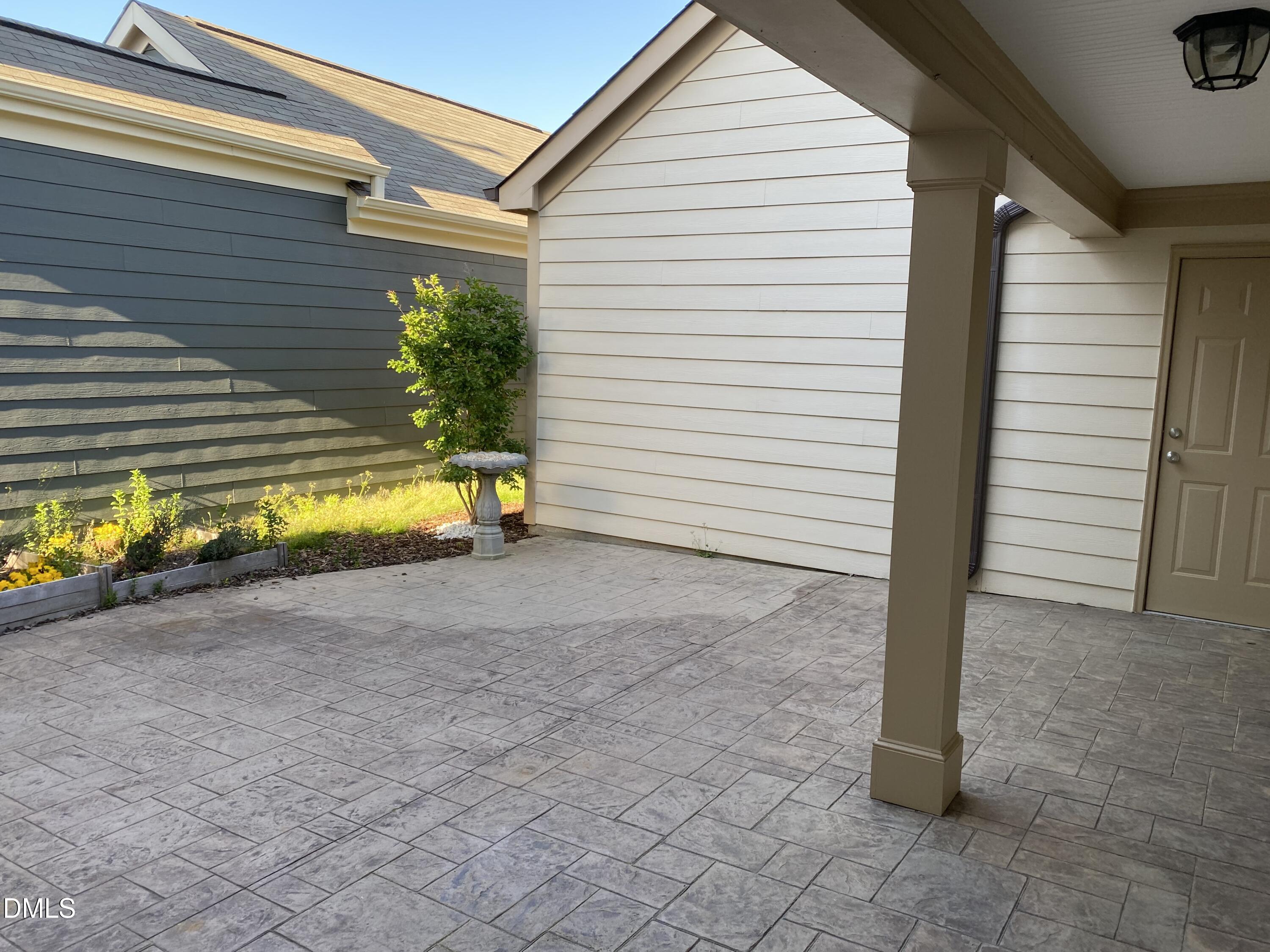 975 Branch Line Lane Apex, NC 27502 - Photo 11 of 12 a view of a house with a yard and a garage