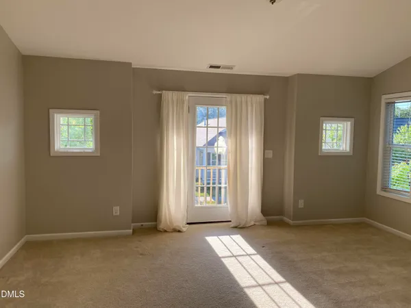 a view of an empty room with windows