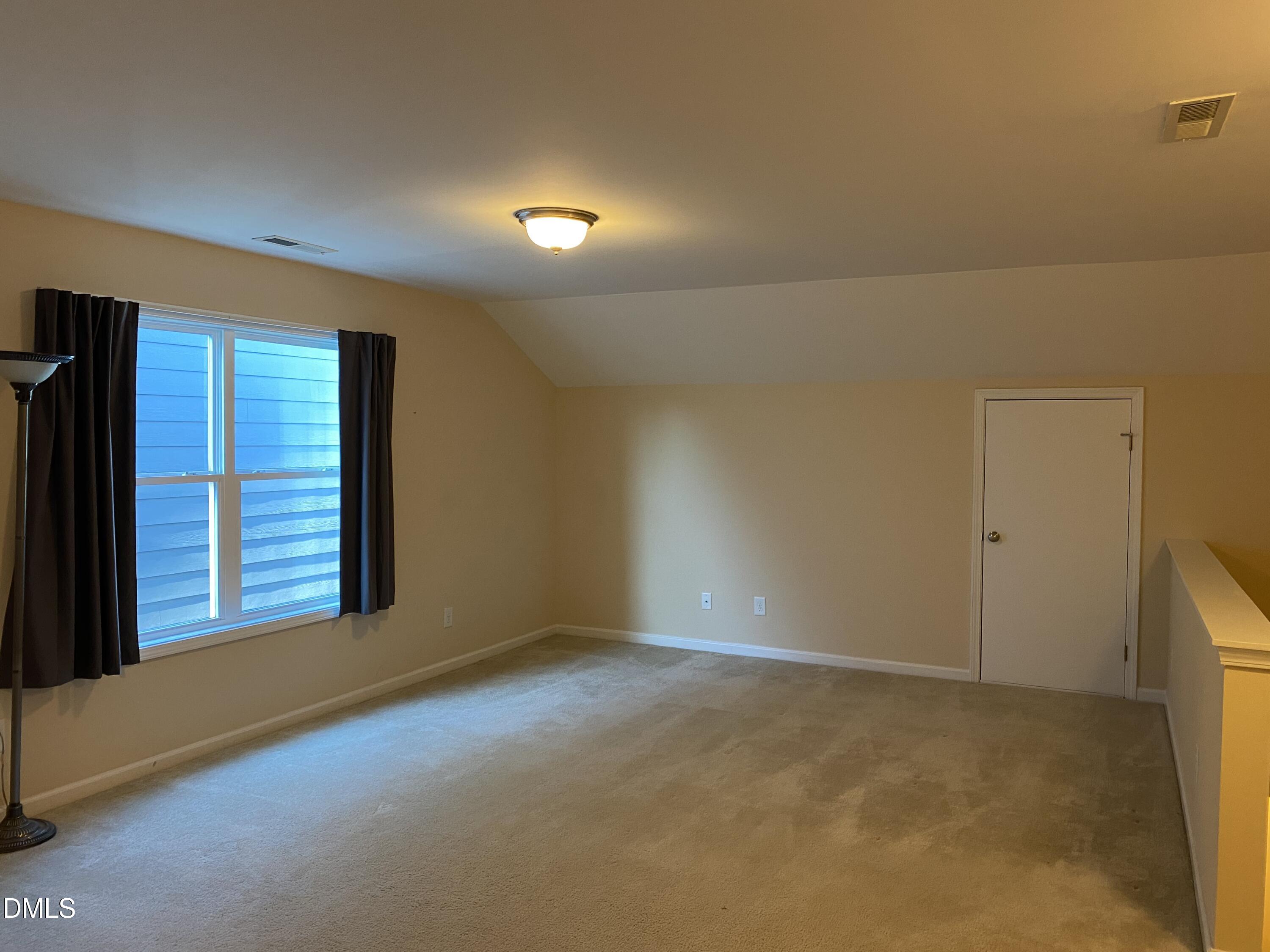 975 Branch Line Lane Apex, NC 27502 - Photo 10 of 12 a view of an empty room with a window