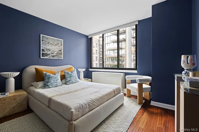 a bedroom with bed and window