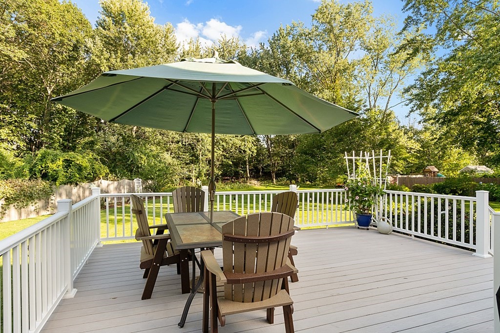 86 Locke Road Chelmsford, MA 01824 - Photo 4 of 41 a view of balcony with furniture and umbrella