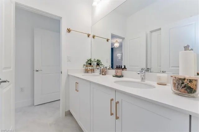 a bathroom with a shower sink and mirror