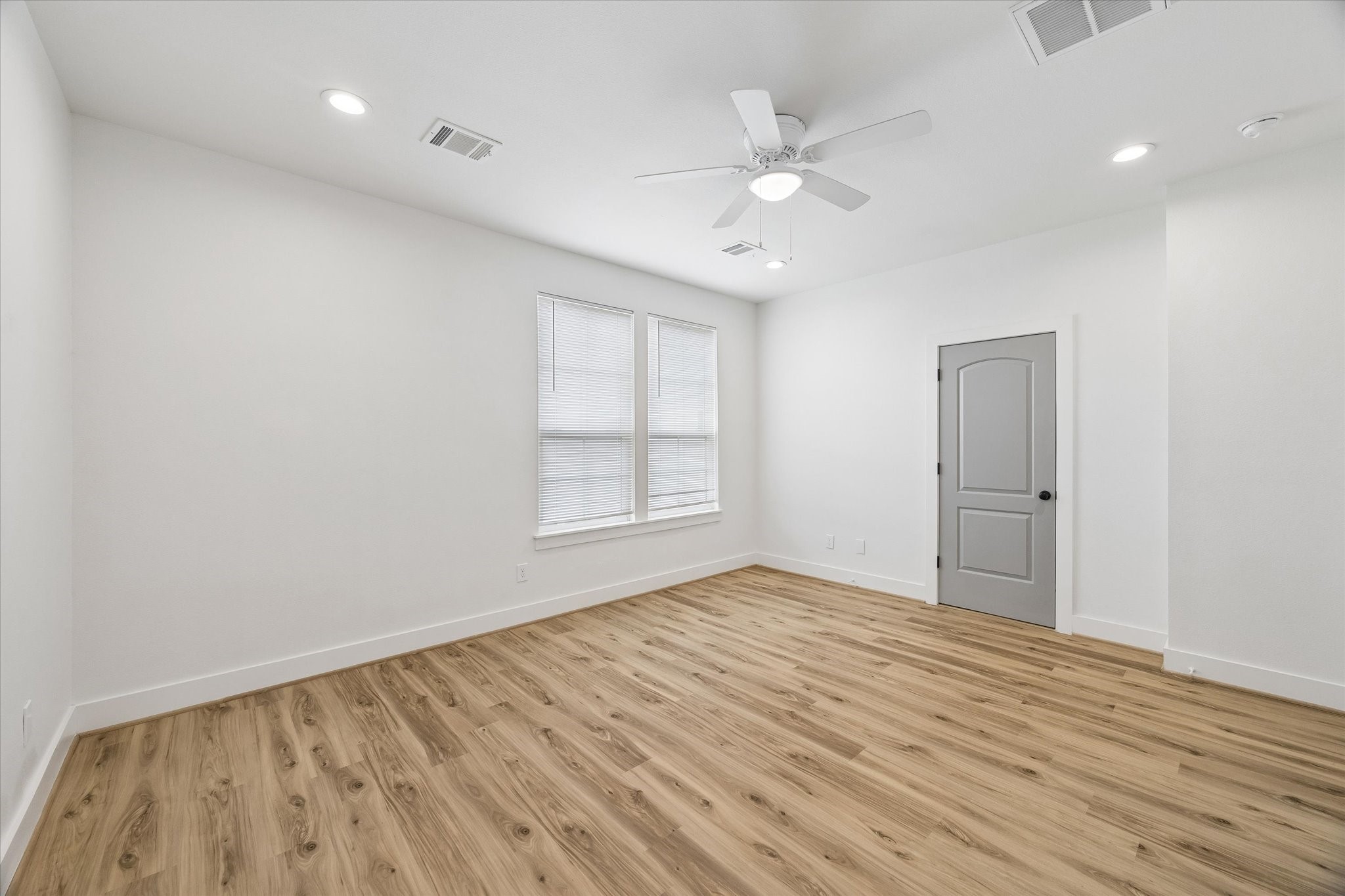 2749 Redrock Street, Unit B Houston, TX 77088 - Photo 14 of 24 A view of the primary bedroom with the corridor accessible through the door on the right.