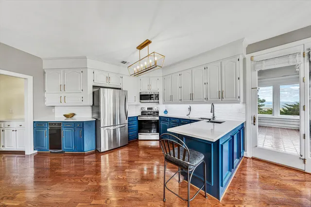 a bathroom with a sink a mirror and a shower