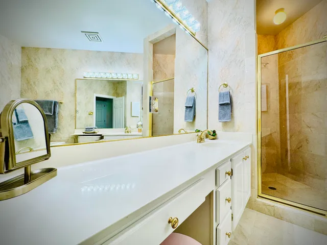 a front view of a multi story residential apartment building with yard and outdoor seating