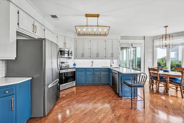 a view of a big yard in front of a brick house