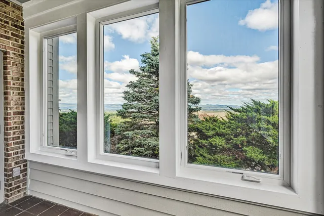 a view of a brick building next to a yard