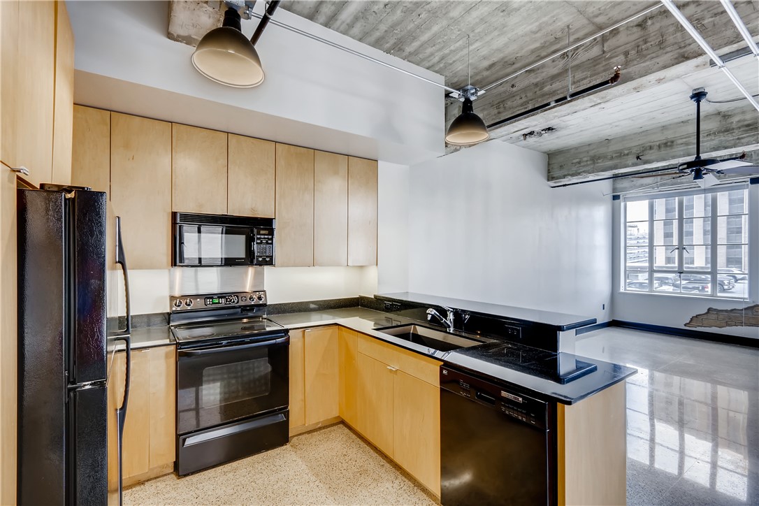 710 Colorado Street, Unit 4J Austin, TX 78701 - Photo 12 of 37 Spacious kitchen with granite counters and tons of cabinets!
