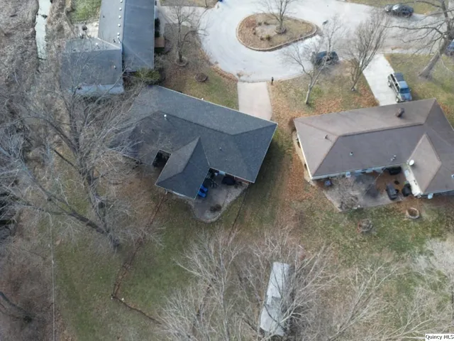 an aerial view of a house with outdoor space
