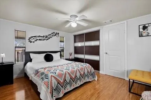 a bedroom with a bed and a window