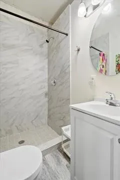 a bathroom with a sink toilet and shower