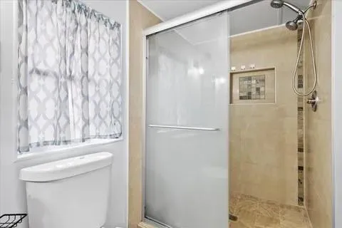 a bathroom with a shower and a sink