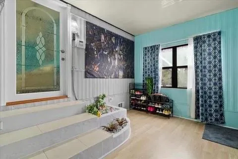 a living room with furniture and a large window