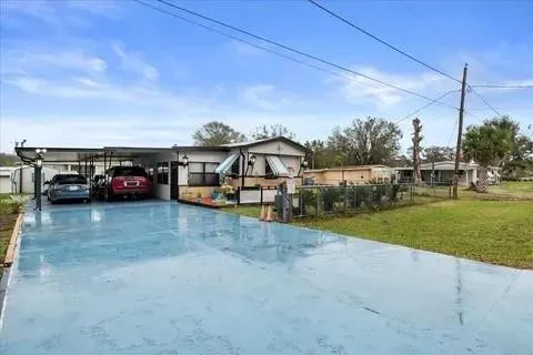 a view of a car park in front of house