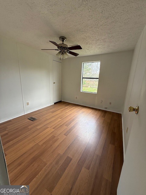 2791 Old Mill Road Rutledge, GA 30663 - Photo 18 of 26 an empty room with a window and a ceiling fan