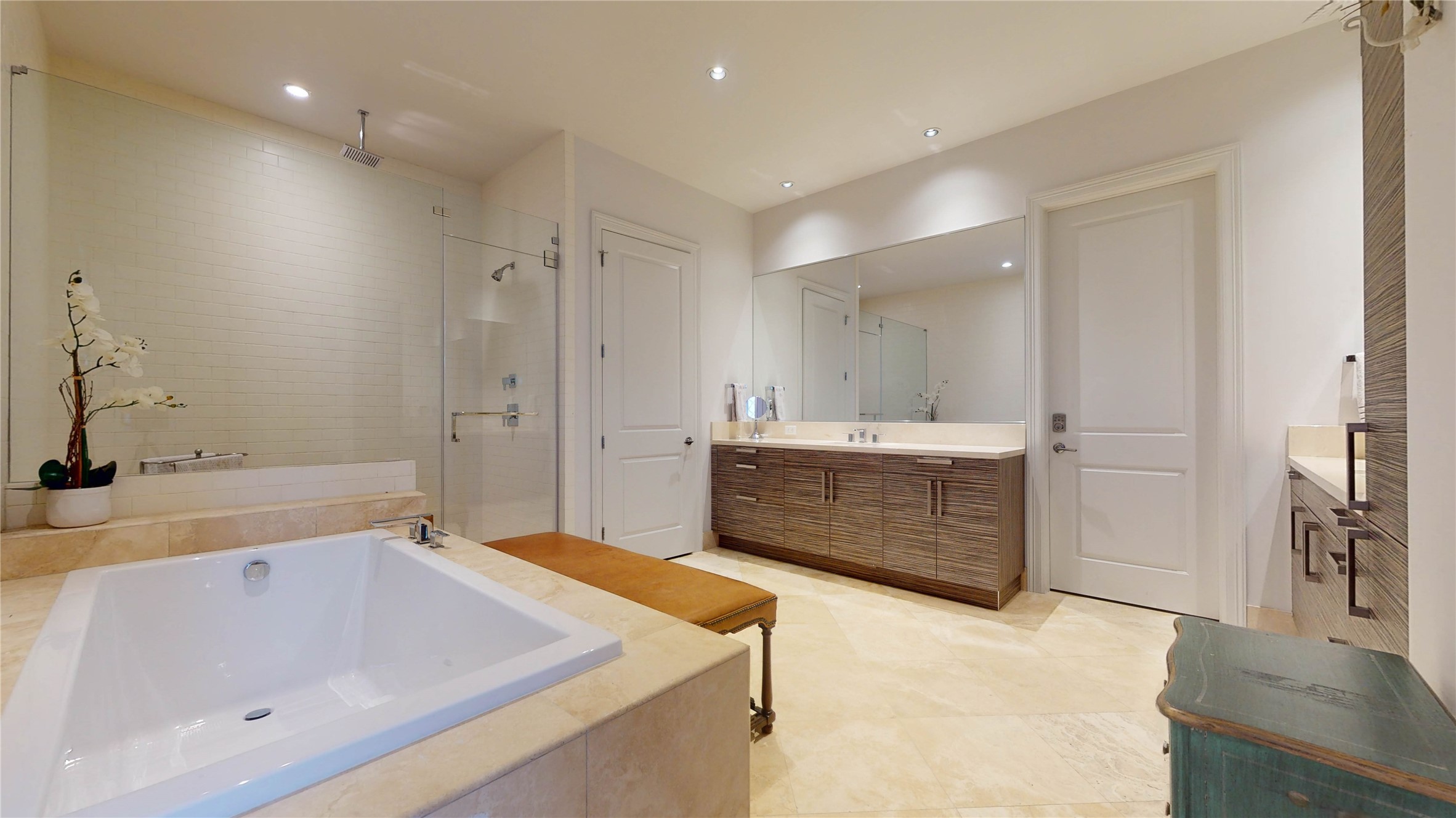 1409 Post Oak Boulevard, Unit 902 Houston, TX 77056 - Photo 11 of 38 a bathroom with a tub a sink shower and mirror