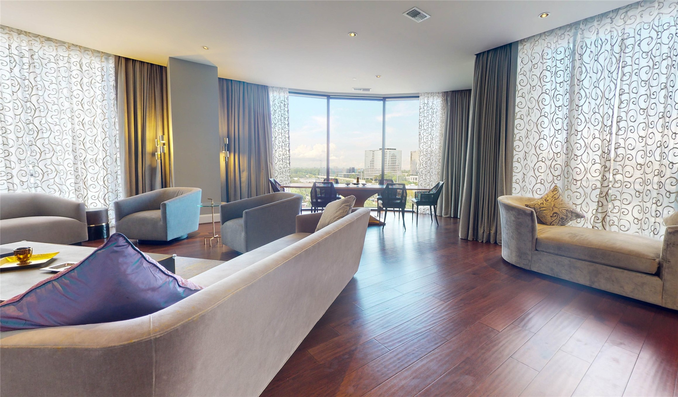 1409 Post Oak Boulevard, Unit 902 Houston, TX 77056 - Photo 13 of 38 a living room with furniture and floor to ceiling windows