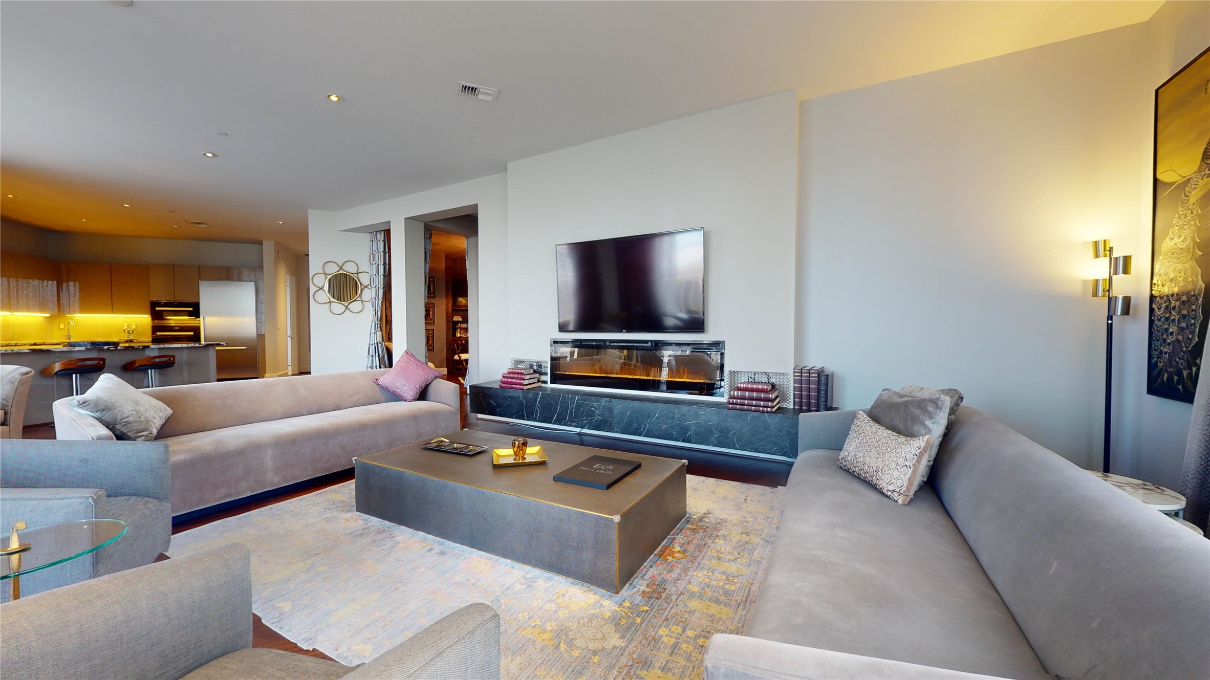 1409 Post Oak Boulevard, Unit 902 Houston, TX 77056 - Photo 16 of 38 a living room with furniture and a flat screen tv