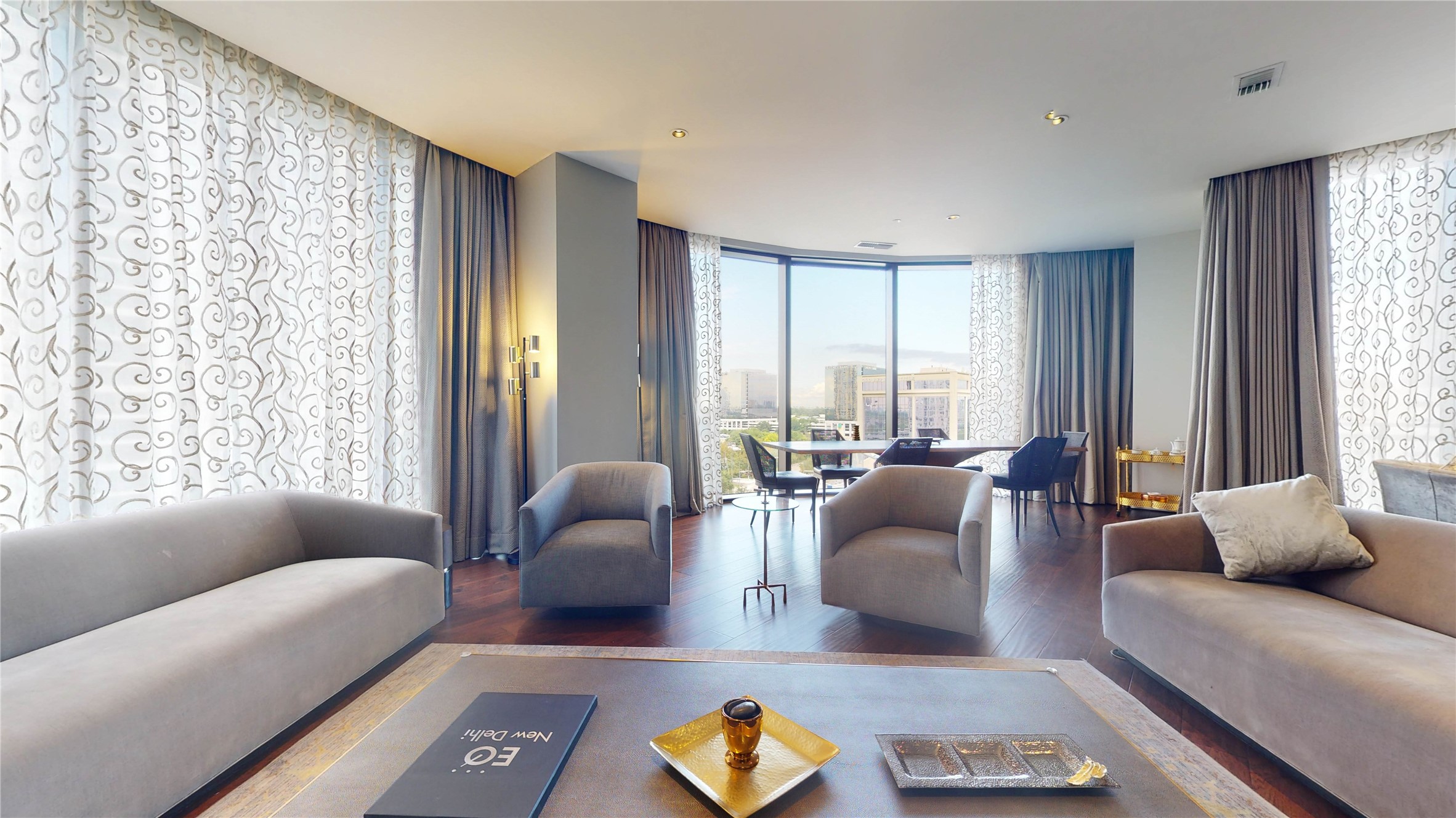 1409 Post Oak Boulevard, Unit 902 Houston, TX 77056 - Photo 17 of 38 a living room with furniture and large windows