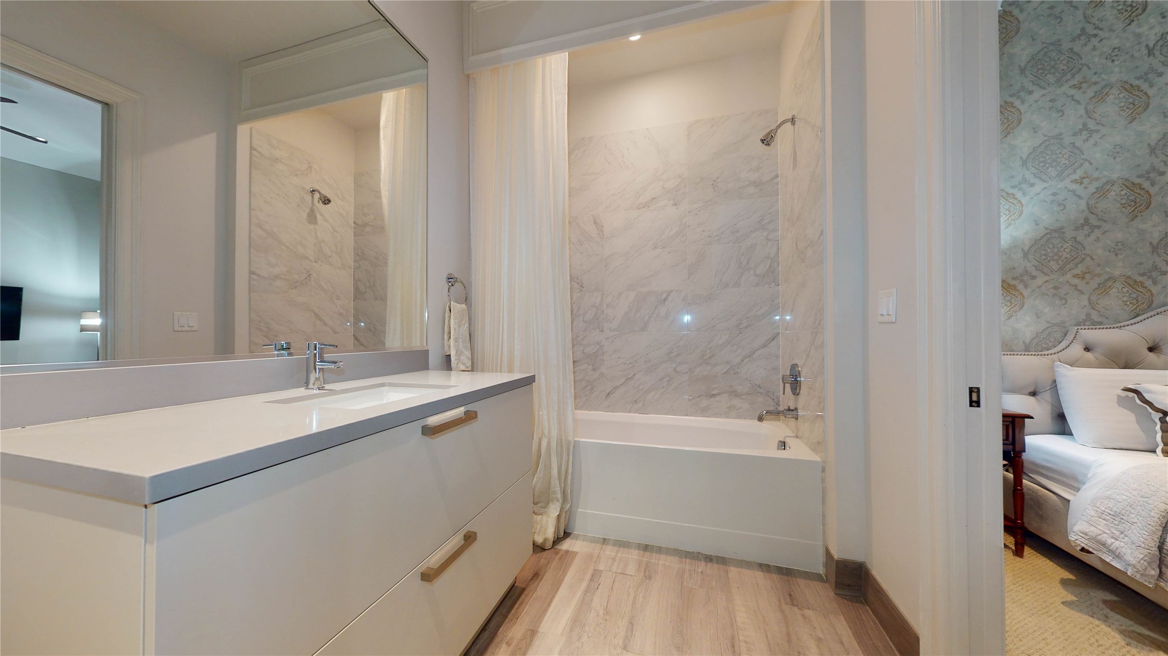 1409 Post Oak Boulevard, Unit 902 Houston, TX 77056 - Photo 25 of 38 a bathroom with a bathtub and a sink