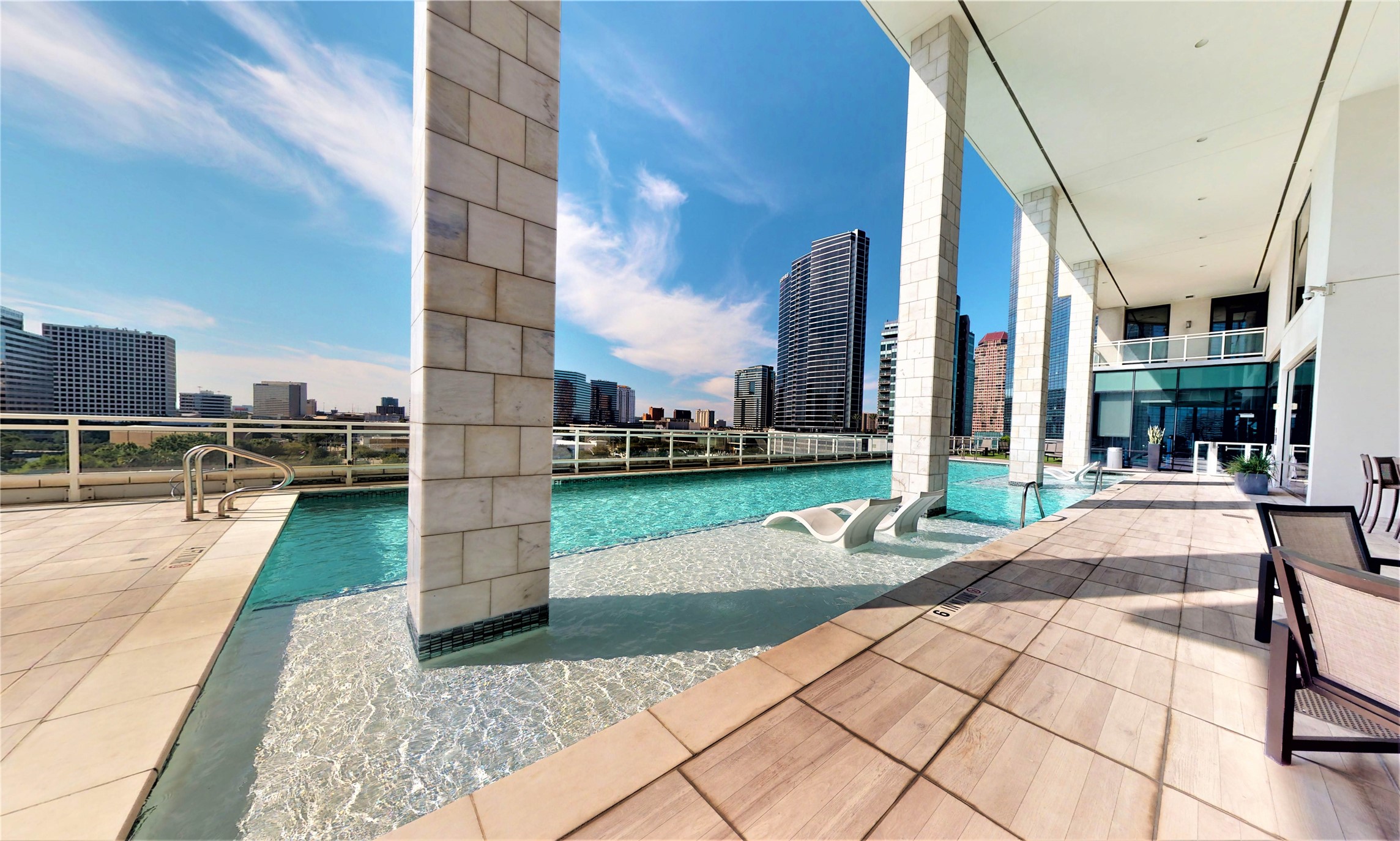 1409 Post Oak Boulevard, Unit 902 Houston, TX 77056 - Photo 27 of 38 a building exterior with furniture