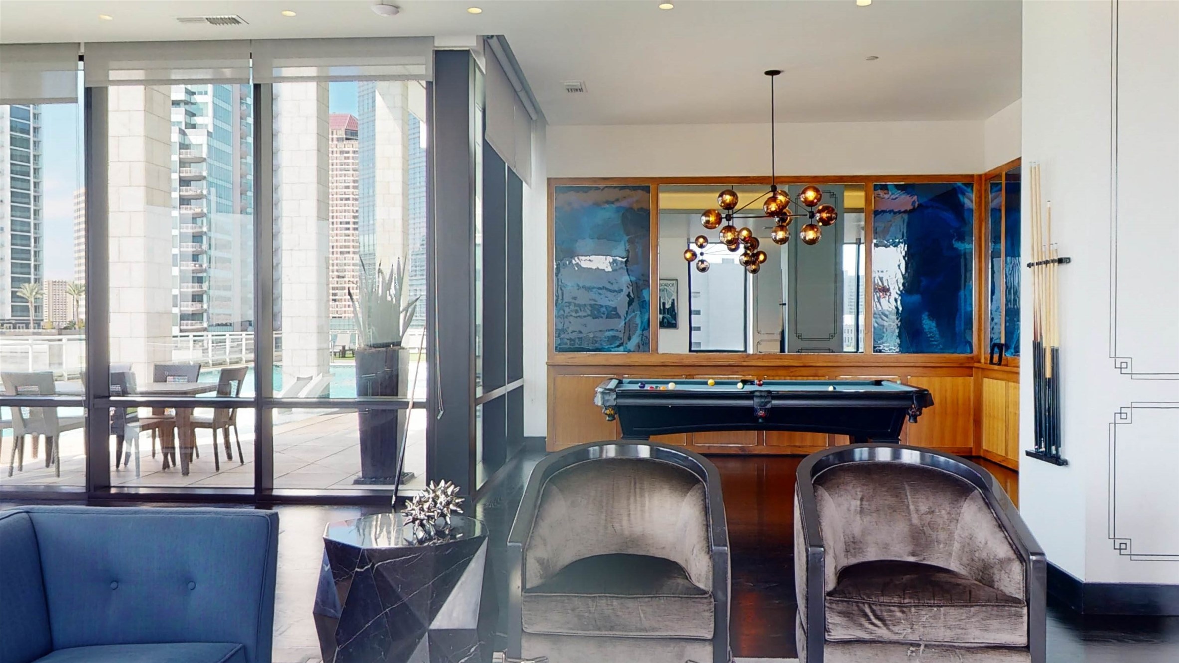 1409 Post Oak Boulevard, Unit 902 Houston, TX 77056 - Photo 28 of 38 a room with furniture and a chandelier