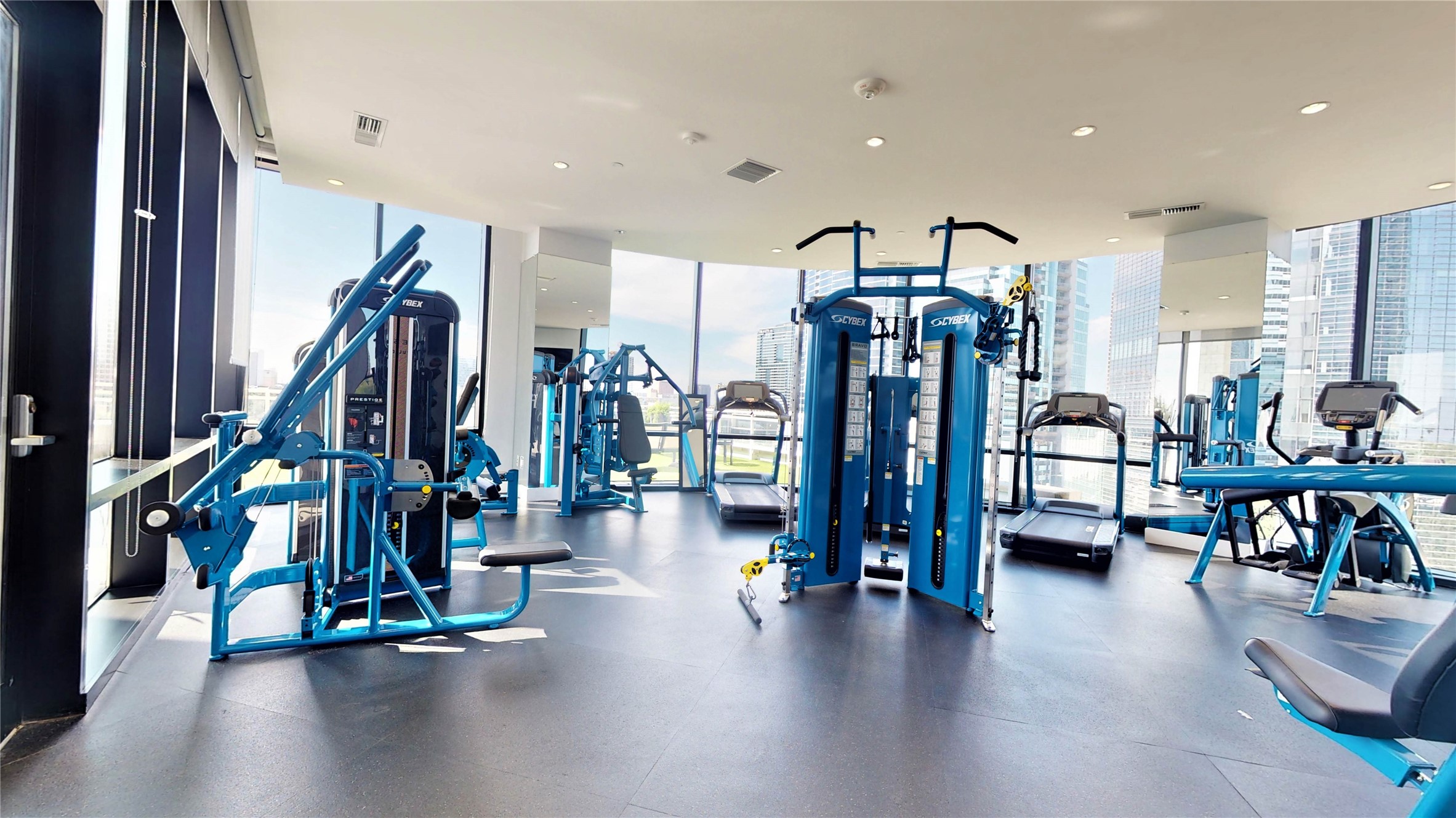 1409 Post Oak Boulevard, Unit 902 Houston, TX 77056 - Photo 32 of 38 a view of an empty room with gym equipment