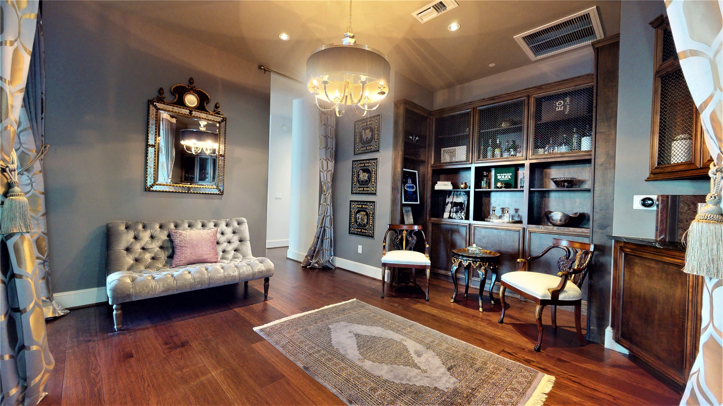 1409 Post Oak Boulevard, Unit 902 Houston, TX 77056 - Photo 9 of 38 a living room with furniture and a chandelier