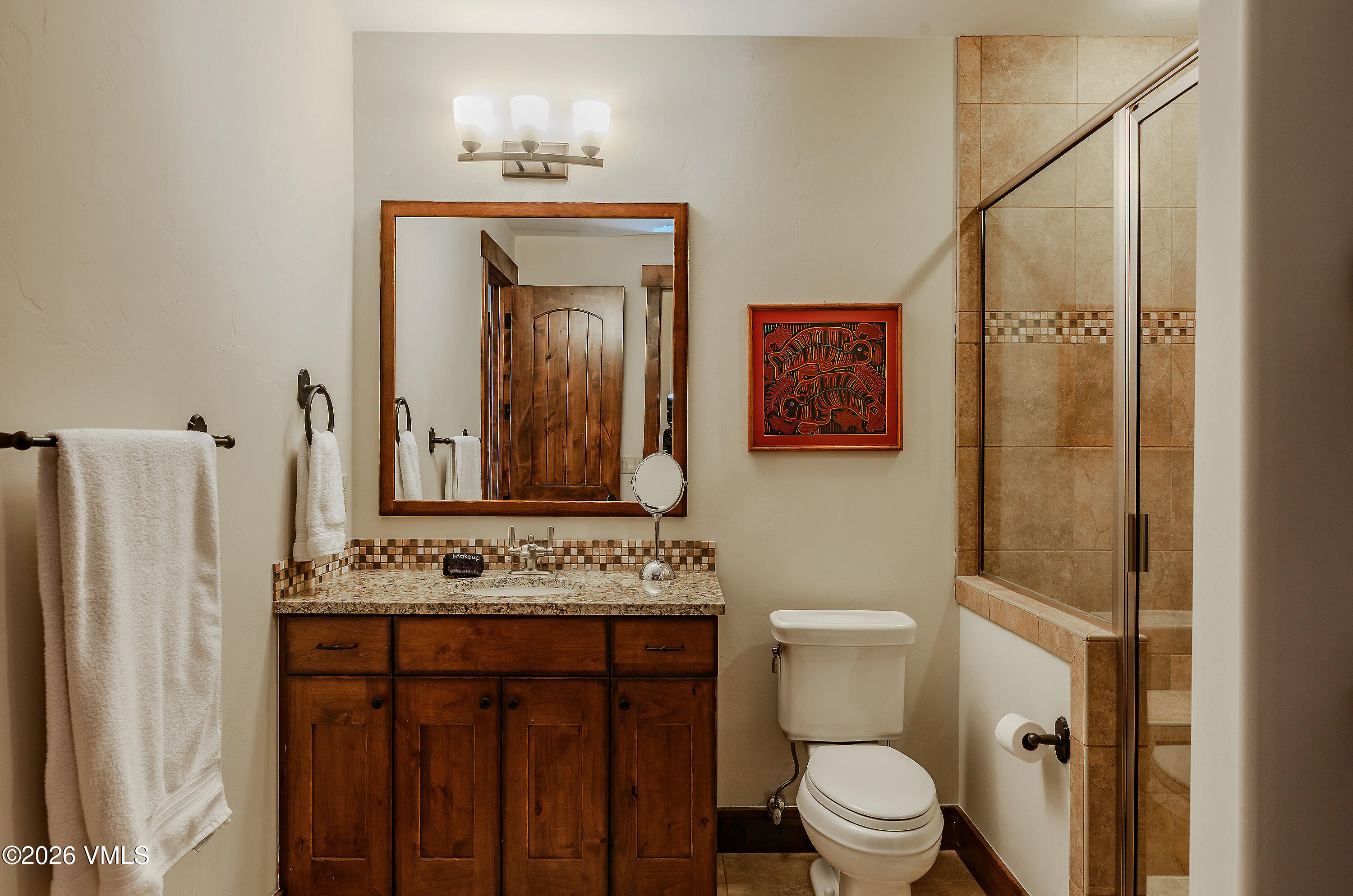 2753 East Haystacker Drive Eagle, CO 81631 - Photo 33 of 41 a bathroom with a sink a toilet and mirror