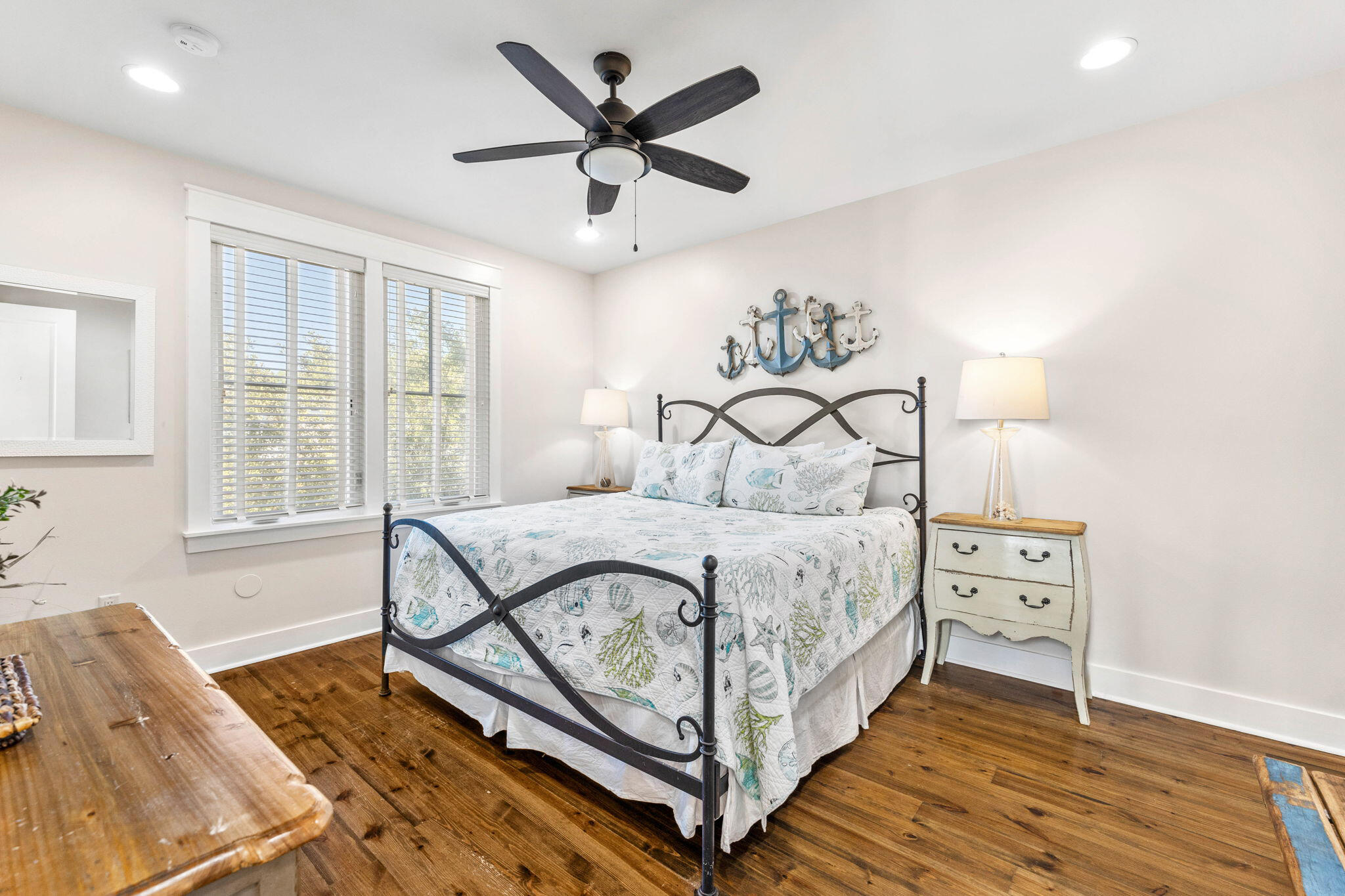 17 Red Basil Drive Santa Rosa Beach, FL 32459 - Photo 34 of 59 a bedroom with a bed and a chandelier