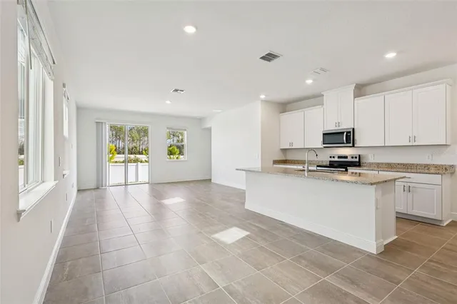 a view of a kitchen with a sink cabinets and window